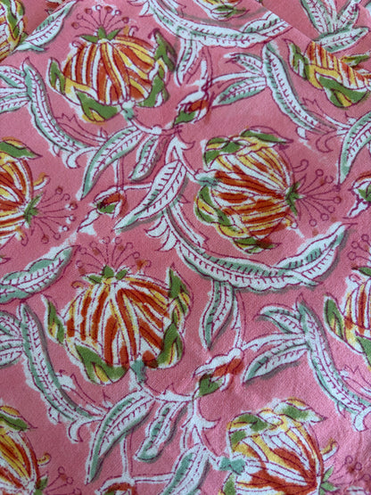 House of Mulmul - Blockprinted Cotton Table Napkins. Floral patterned fabric with colorful flowers on a pink background