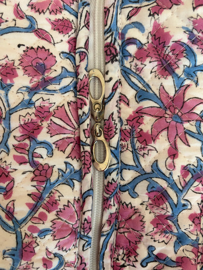 House of Mulmul - Blockprinted Cotton Tote Bag, Travel Bag. Close-up of a quilted tote bag with a pink and blue floral block-print pattern on a cream background, featuring a metal zipper.