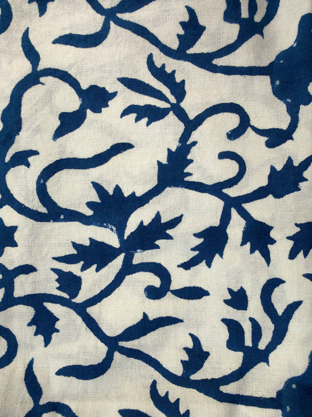 House of Mulmul - Blockprinted Cushion Covers-Pillow Cases. A close-up of a fabric pattern featuring dark navy blue floral and vine motifs printed on an off-white linen-like background.