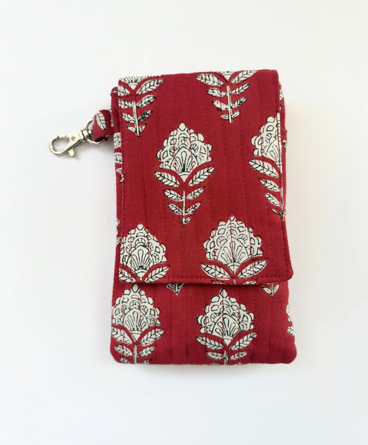 House of Mulmul - Blockprinted Mobile Sling Bag. A red quilted fabric pouch with a silver and white block print pattern, featuring a silver metal clasp on the side, shown on a plain white background.