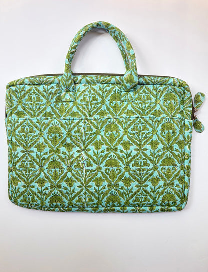 House of Mulmul - Blockprinted Cotton Quilted Laptop Bag. A quilted laptop sleeve featuring a green and turquoise damask pattern, with top handles and a zippered side pocket, shown against a plain white background.