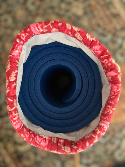 House of Mulmul - Blockprinted Yoga Mat Cover. Blue yoga mat rolled up in a red and white patterned mat holder