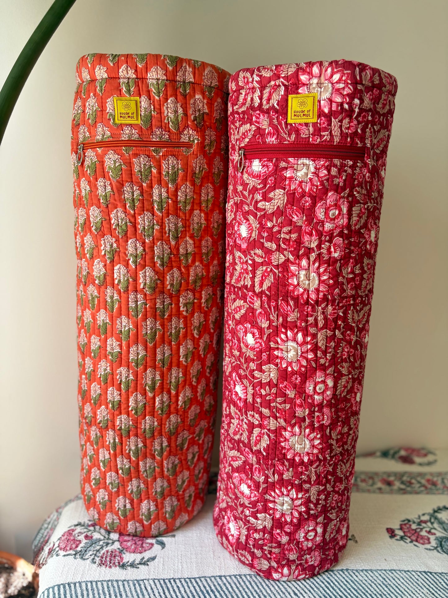 House of Mulmul - Blockprinted Yoga Mat Cover. Two floral-patterned yoga bags on a table with a light background