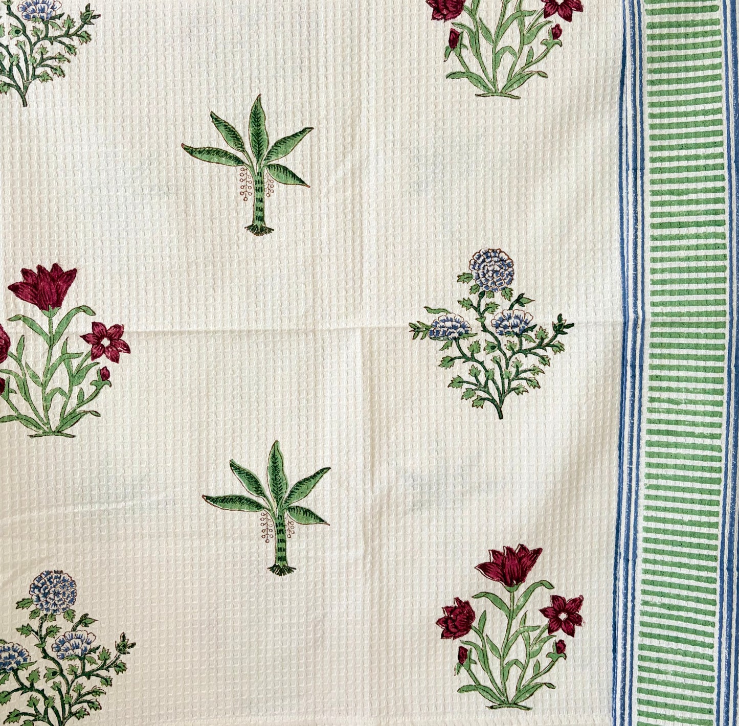 House of Mulmul - Cotton Bath and Hand Towel set. Cotton towel with floral and leaf patterns on a white background