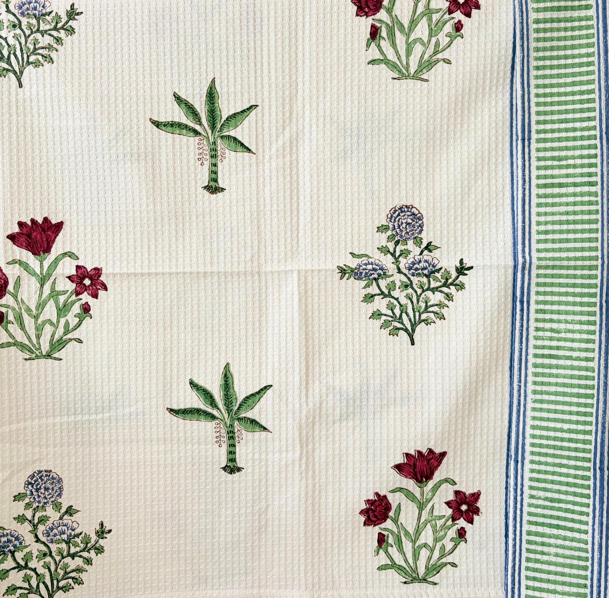 House of Mulmul - Cotton Bath and Hand Towel set. Cotton towel with floral and leaf patterns on a white background