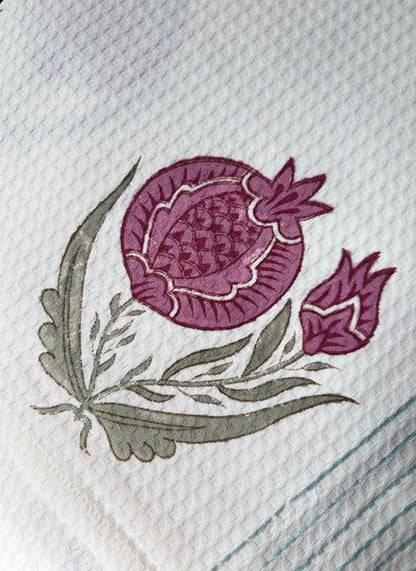House of Mulmul - Cotton Bath Towel. Hand block printed purple flower and green leaves on a white fabric background