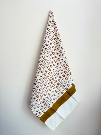 House of Mulmul - Cotton Bath and Hand Towel set. Floral patterned towel with a brown border on a white background