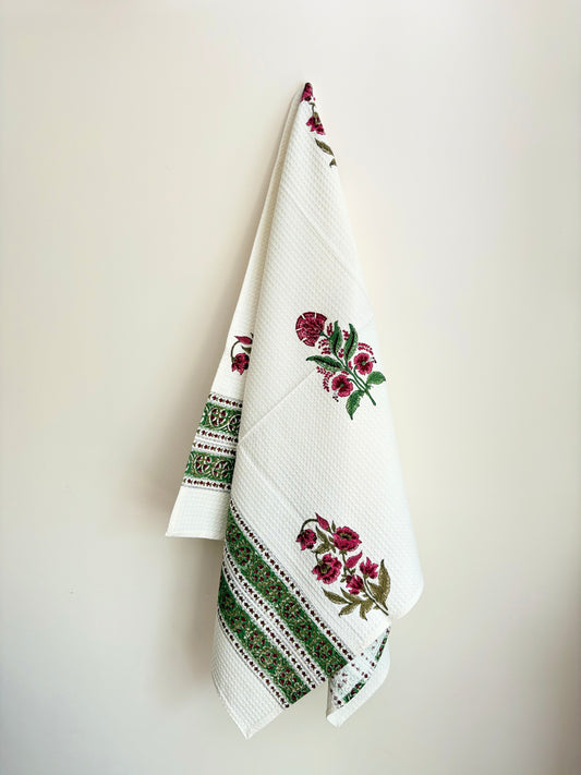 House of Mulmul - Cotton Bath Towel. Decorative towel with floral and geometric patterns on a plain background