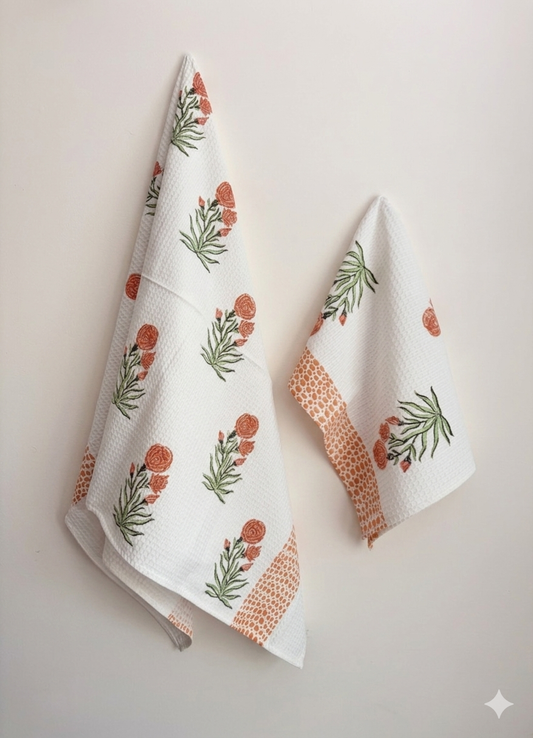 House of Mulmul - Cotton Bath and Hand Towel set. Two floral patterned towels on a light background