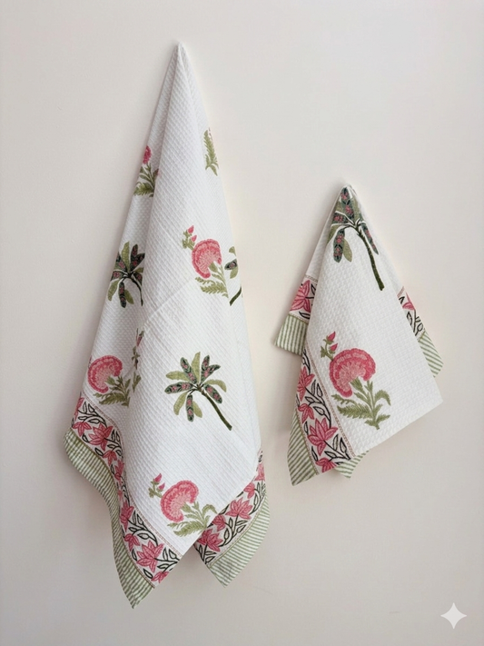 House of Mulmul - Cotton Bath and Hand Towel set. Two floral patterned towels on a plain background