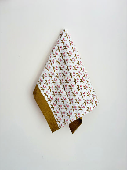 House of Mulmul - Cotton Bath and Hand Towel set. Floral patterned towel with brown border on a white background