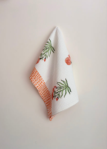 House of Mulmul - Cotton Bath and Hand Towel set. White towel with floral patterns on a light gray background