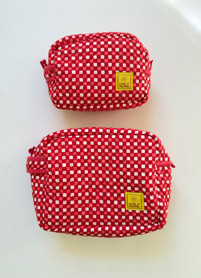 House of Mulmul - Cotton Quilted Travel Makeup Pouch set. Two red and white gingham check cosmetic pouches with yellow brand labels, displayed on a clean white background.