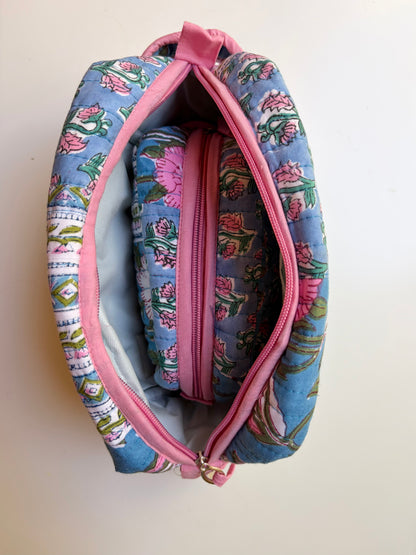 House of Mulmul - Handblock Printed Travel Makeup Quilted Pouch set. Floral-patterned makeup bag with pink zipper on a white background
