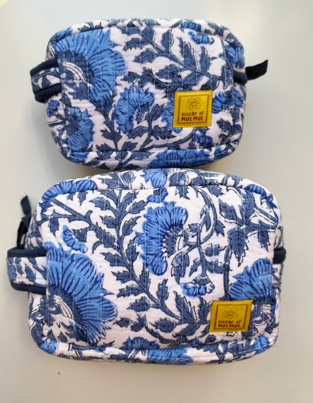 House of Mulmul - Quilted Blockprint Travel Makeup pouch set. Blue and white patterned pouch set with a zipper.