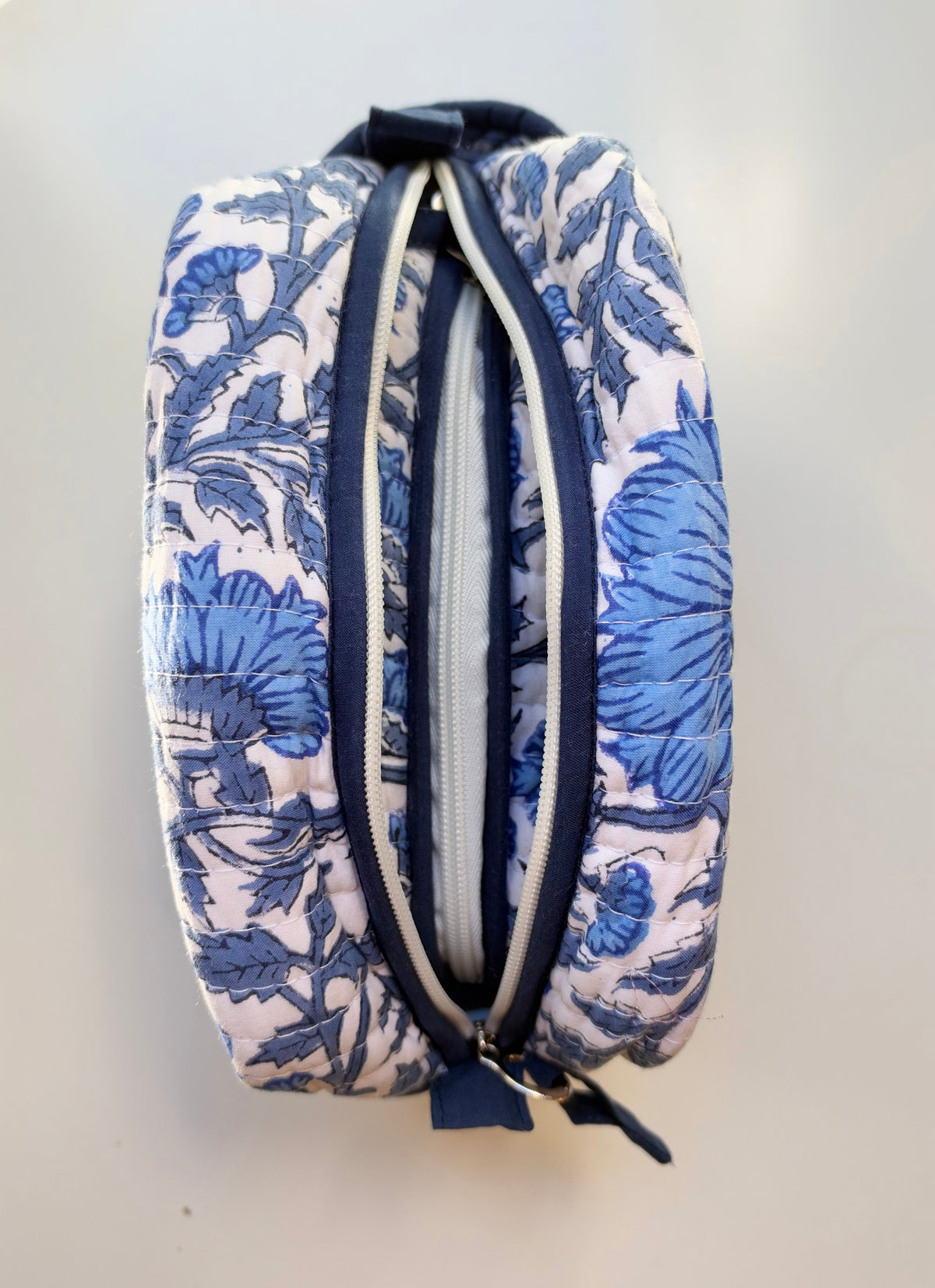 House of Mulmul - Quilted Blockprint Travel Makeup pouch set. Blue and white patterned pouch set with a zipper.