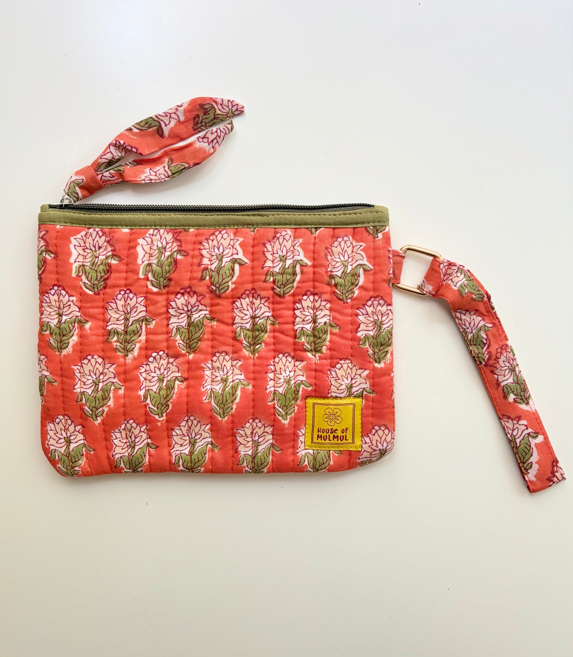 Hand Block Printed Quilted Travel Wristlet Pouch & Organizer. Floral patterned pouch with strap on a white background