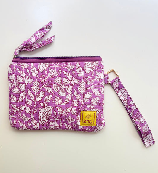 Hand Block Printed Quilted Travel Wristlet Pouch & Organizer. Purple floral-patterned pouch with matching strap on a white background