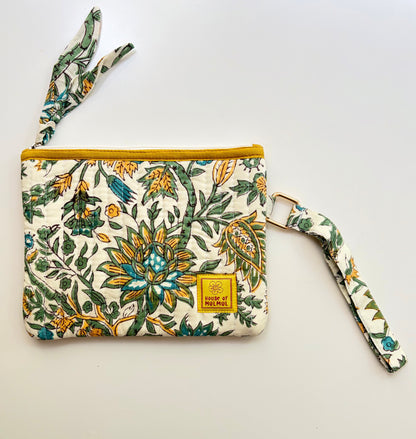 Hand Block Printed Quilted Everyday Wristlet Pouch & Organizer. Floral-patterned pouch with a yellow zipper on a light gray background