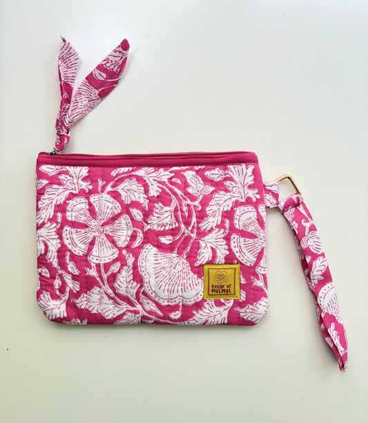 Hand Block Printed Quilted Travel Wristlet Pouch & Organizer. Pink pouch with white floral pattern and matching strap on a white background