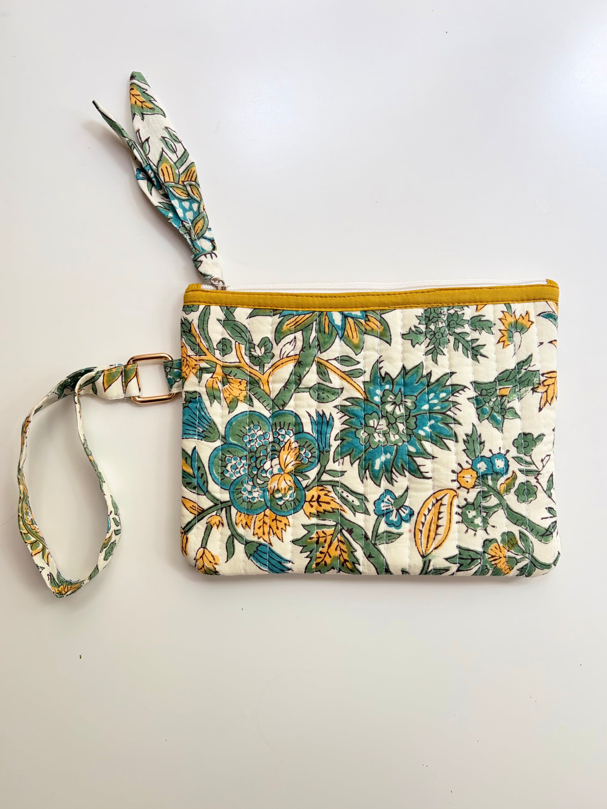 Hand Block Printed Quilted Everyday Wristlet Pouch & Organizer. Floral patterned wristlet with a yellow zipper on a white background