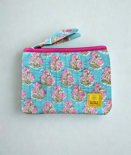 House of Mulmul - Quilted Flat Passport Pouch. Floral-patterned quilted pouch with a pink zipper on a white background.