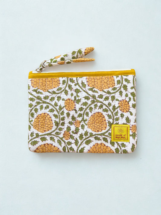 House of Mulmul - Quilted Flat Passport Pouch. Patterned pouch with yellow zipper on a white background.