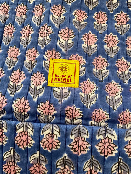 Floral patterned handblock printed fabric with a 'House of Mulmul' label.