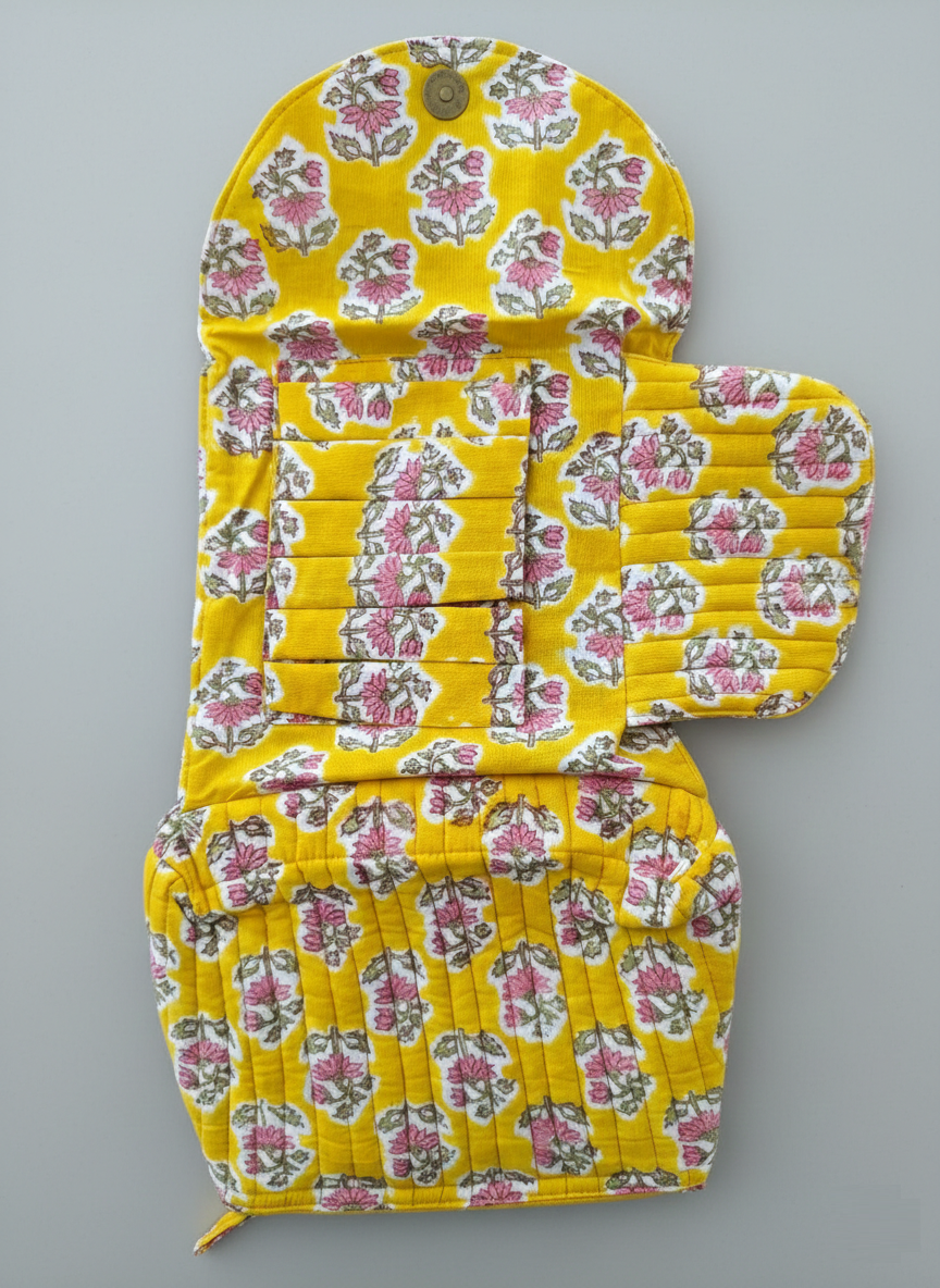 House of Mulmul - Quilted Foldable Travel Makeup pouch. Yellow pink makeup bag with white floral pattern on a white background