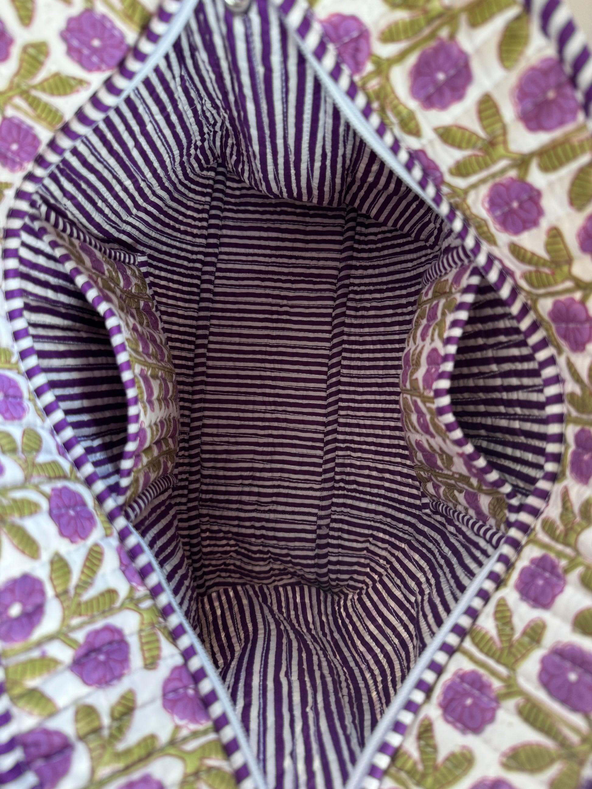 House of Mulmul - Cotton Tote Bag, Travel Bag. Close-up of a fabric interior with pockets and floral patterned exterior