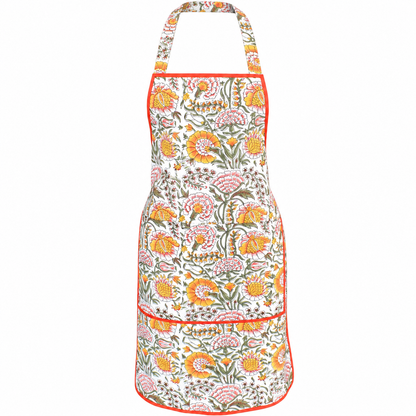 House of Mulmul - Blockprint Cotton Apron. A white apron with a vibrant orange, pink, and green floral block-print pattern, featuring a neck strap and two front pockets with orange piping.