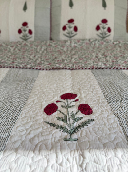 House of Mulmul - Blockprinted Cotton Bedcover Reversible Muslin. Close-up of a cotton quilt with floral embroidery.