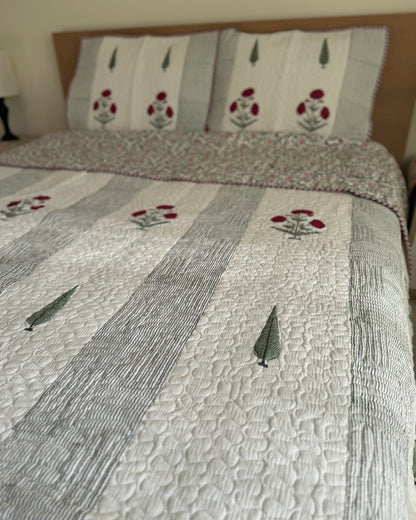 House of Mulmul - Blockprinted Cotton Bedcover Reversible Muslin. Cotton bedcover with floral patterns on a bed