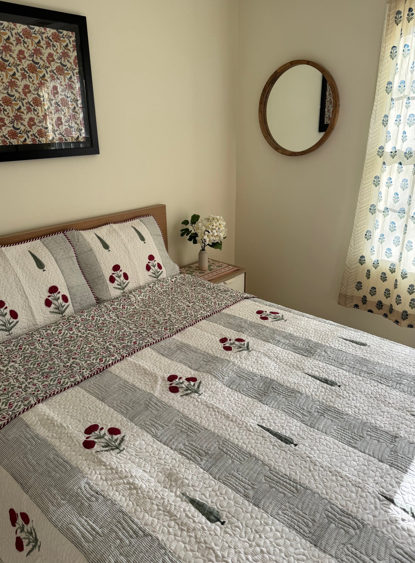 House of Mulmul - Blockprinted Cotton Bedcover Reversible Muslin. Bedroom with floral cotton bedspread, pillows, and decor elements.
