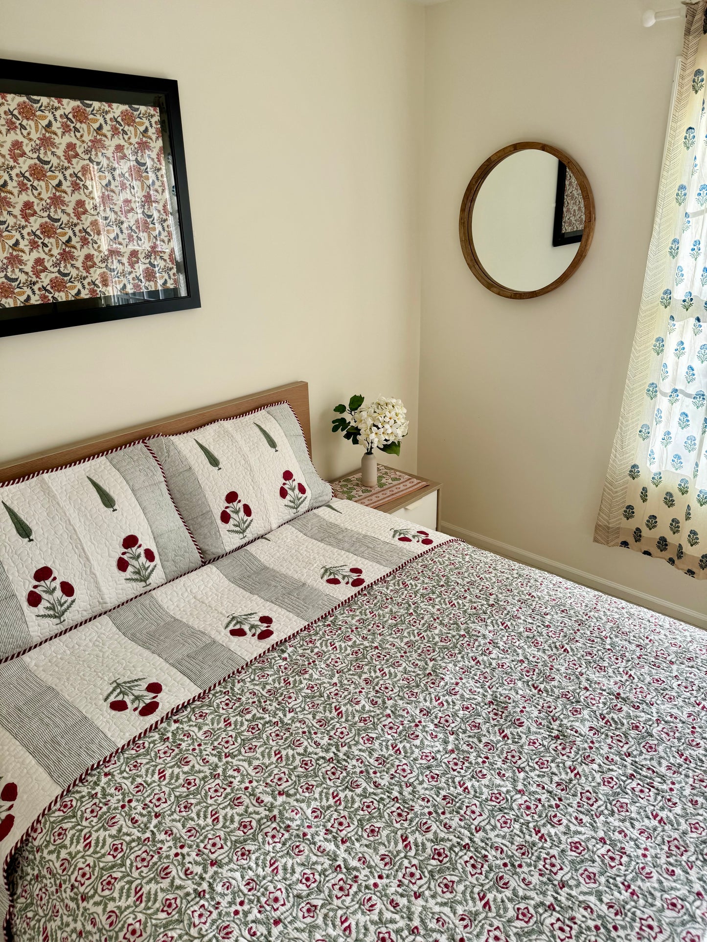 House of Mulmul - Blockprinted Cotton Bedcover Reversible Muslin. Bedroom with floral-patterned cotton bedspread, pillows, and decor elements.