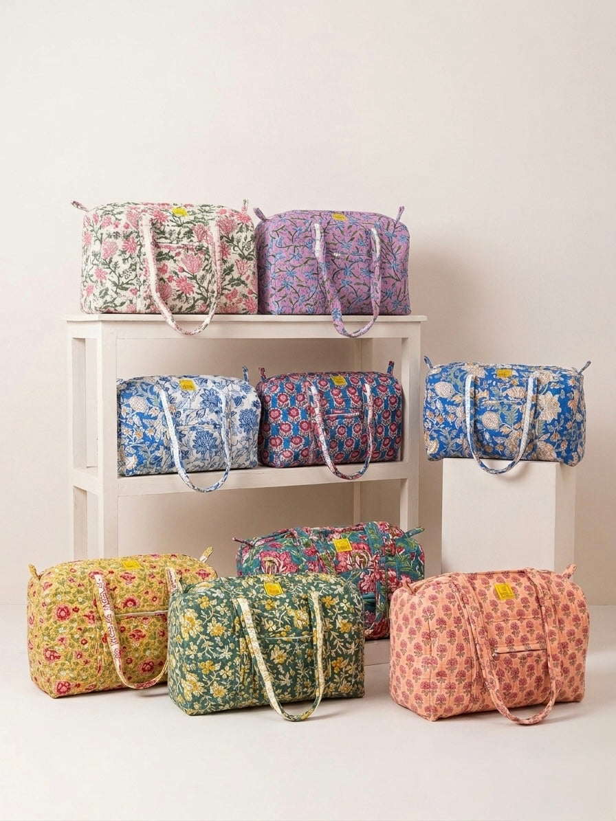 House of Mulmul - Blockprinted Cotton Duffle Bag Weekender Bag. Collection of floral-patterned cotton duffle bags.