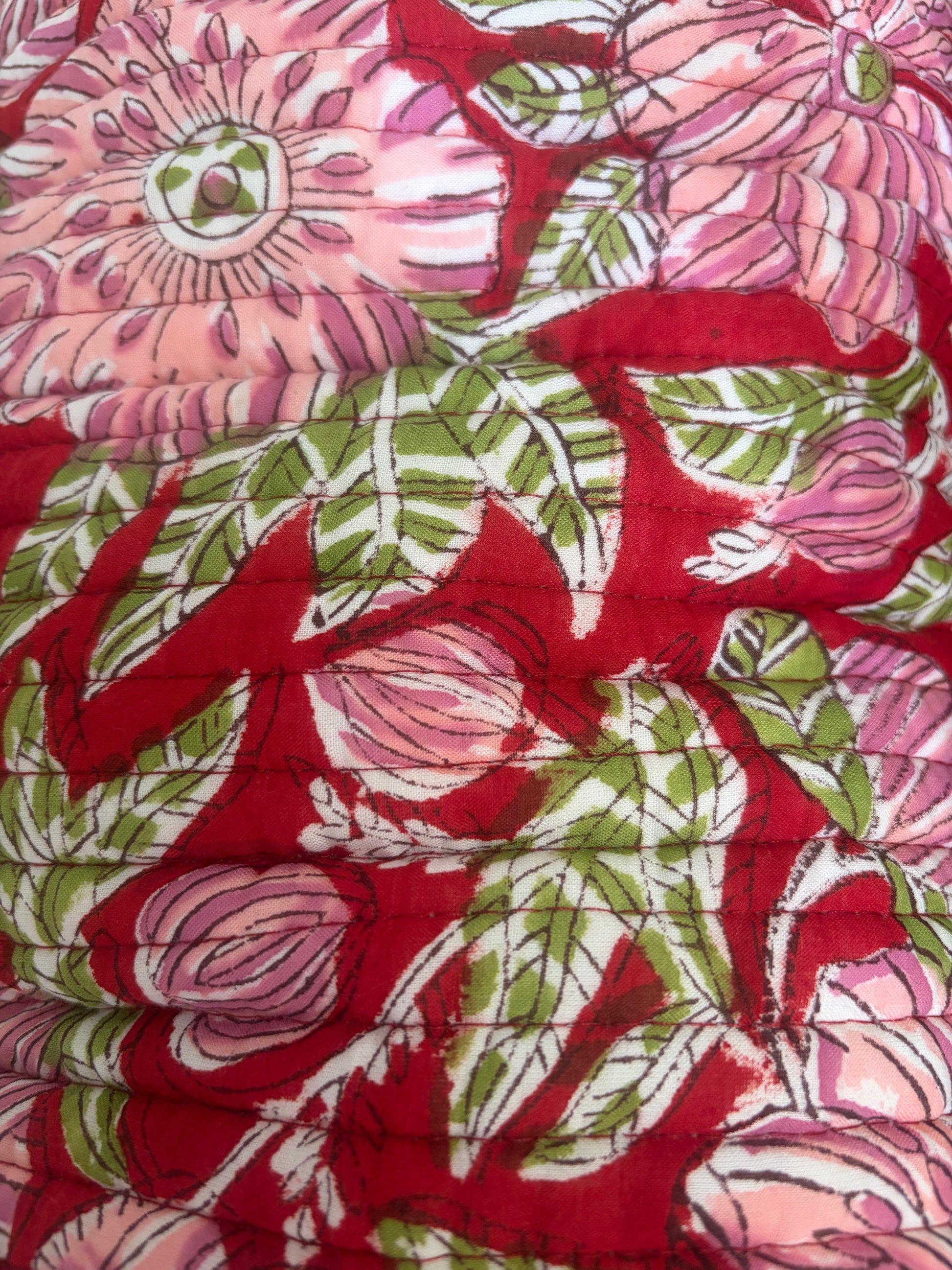 House of Mulmul - Blockprinted Cotton Hair Tool Bag. Close-up of floral hair tool bag with pink, green, and red colors
