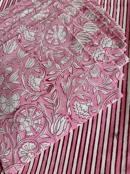 House of Mulmul - Blockprinted Cotton Mats and Napkins. Pink maps and napkins with white floral pattern on a striped background