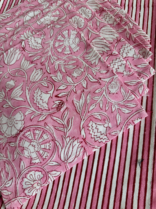 House of Mulmul - Blockprinted Cotton Mats and Napkins. Pink maps and napkins with white floral pattern on a striped background