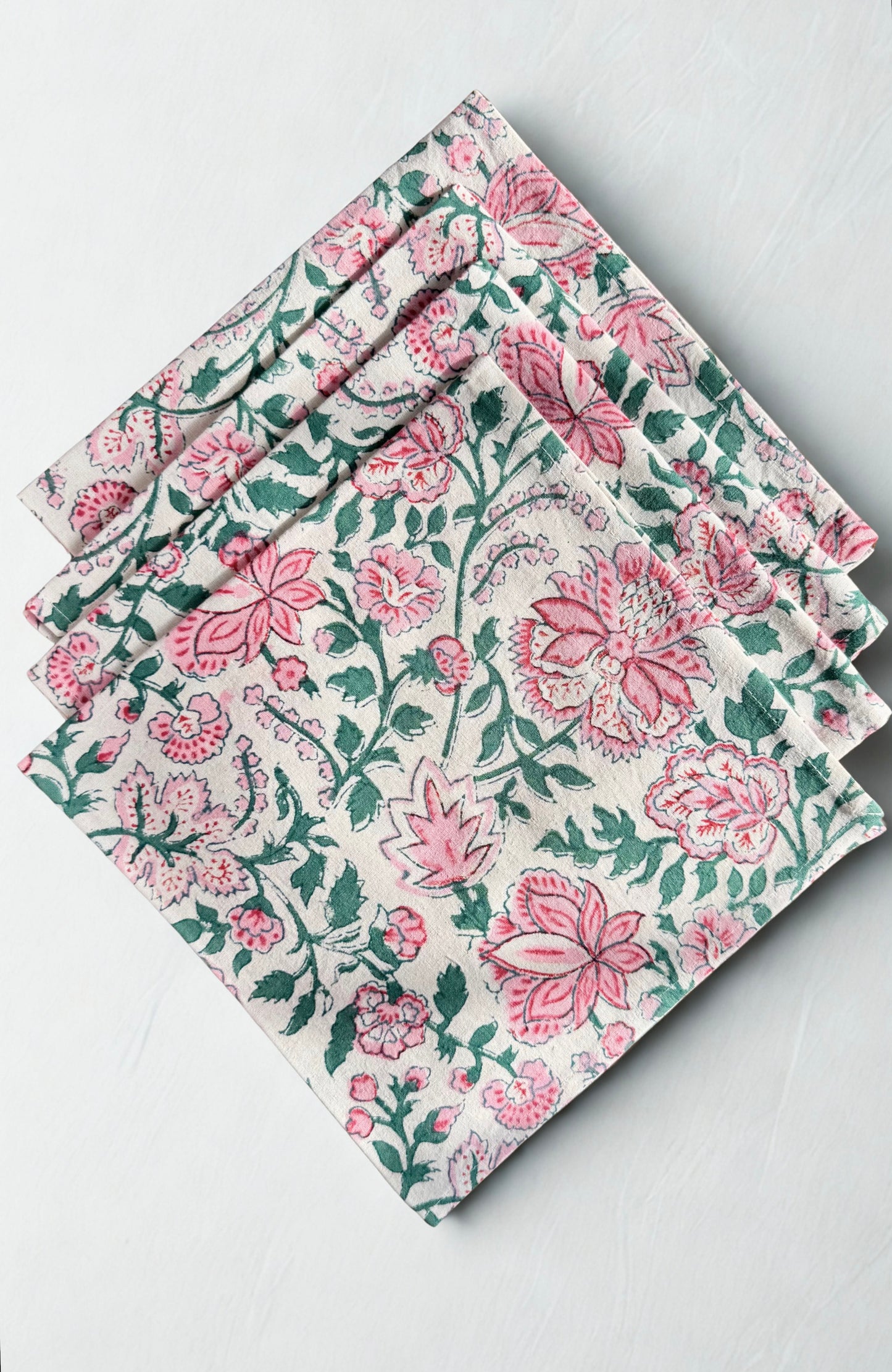 House of Mulmul - Blockprinted Cotton Napkins. Set of floral patterned napkins on a white surface