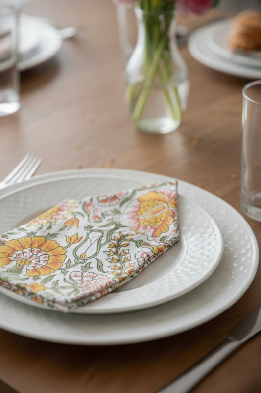 House of Mulmul - Blockprinted Cotton Napkins. Set table with floral napkin on a wooden table