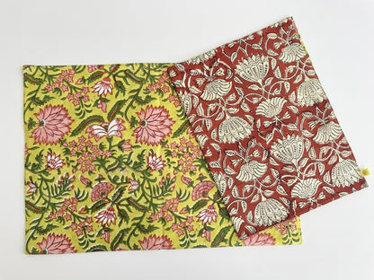 House of Mulmul - Blockprinted Cotton Reversible Table Runner & Mats set. Two floral-patterned placemats on a white background