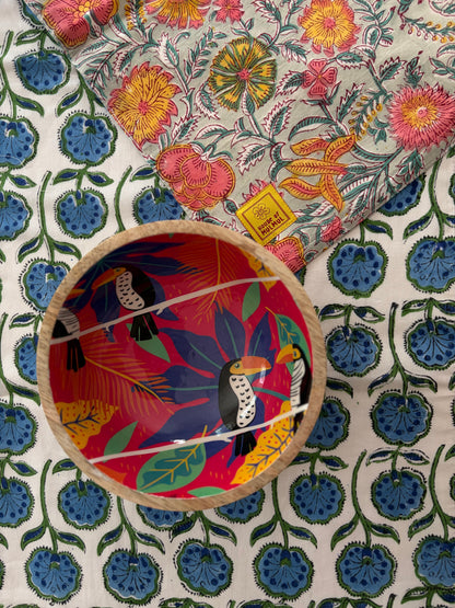House of Mulmul - Blockprinted Cotton Reversible Table Runner & Mats set. Colorful wooden bowl with bird design on a floral fabric background
