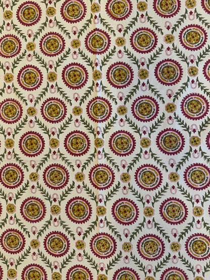 House of Mulmul - Blockprinted Cotton Table Cloth. Patterned table cover with circular designs in red, yellow, and green on a beige background