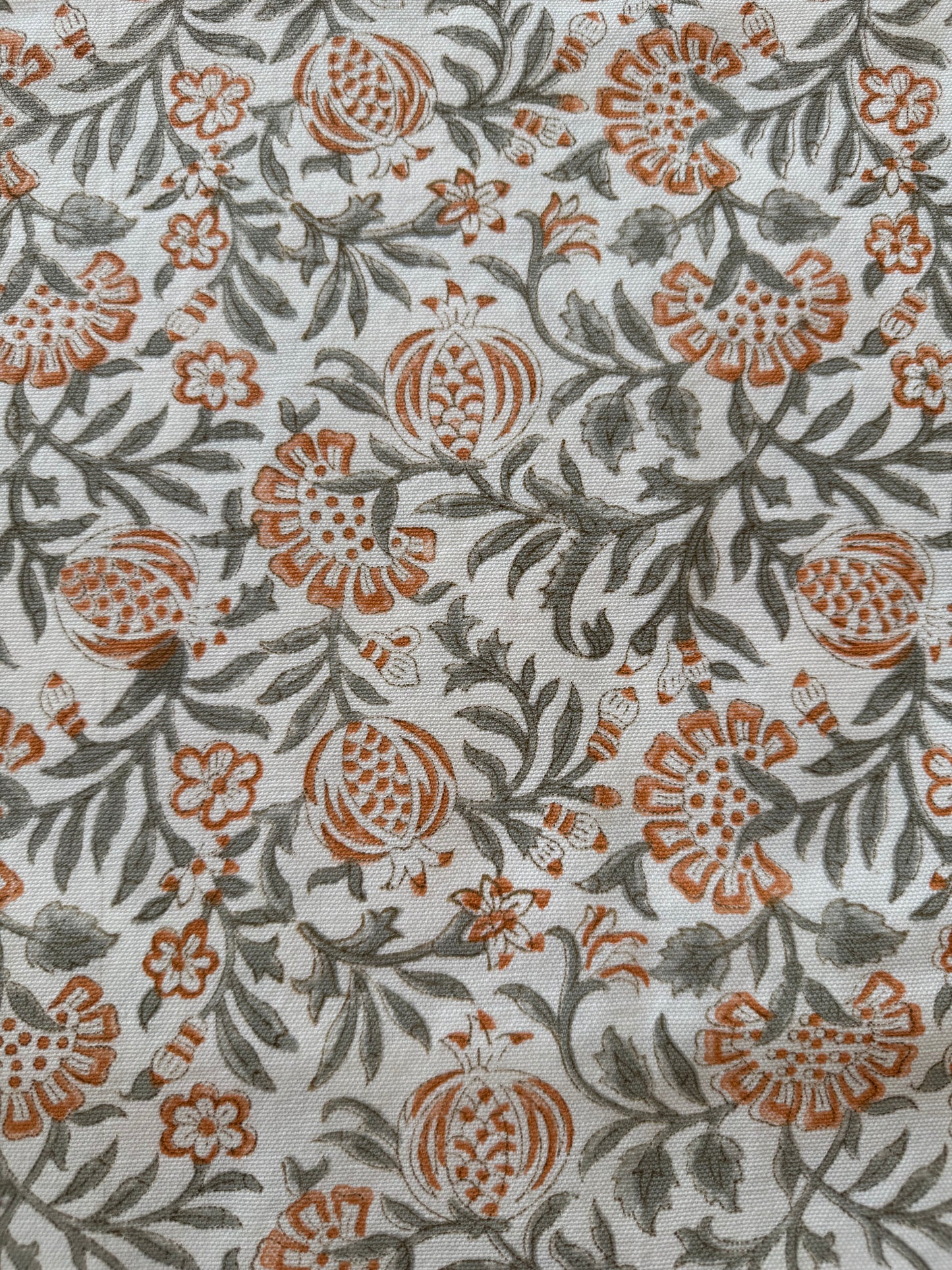 House of Mulmul - Blockprinted Cotton Table Cloth. Floral patterned fabric with orange and green design on a white background