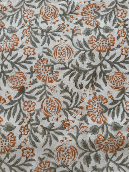 House of Mulmul - Blockprinted Cotton Table Cloth. Floral patterned fabric with orange and green design on a white background