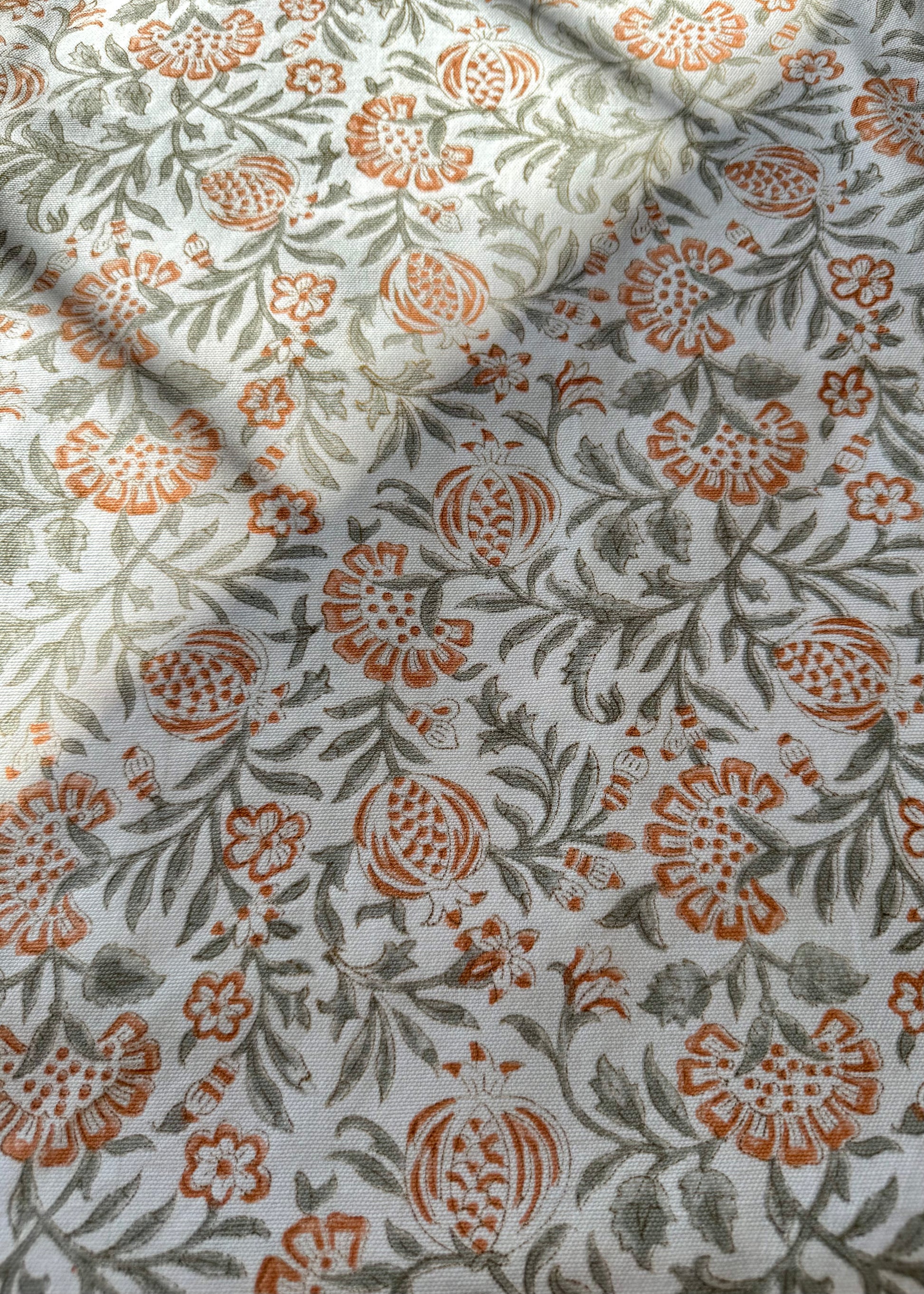 House of Mulmul - Blockprinted Cotton Table Cloth. Floral patterned table cover with orange and green colors on a light background