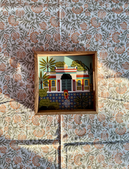 House of Mulmul - Blockprinted Cotton Table Cloth. Cotton table cover with a wooden tray and orange pomegranate design.