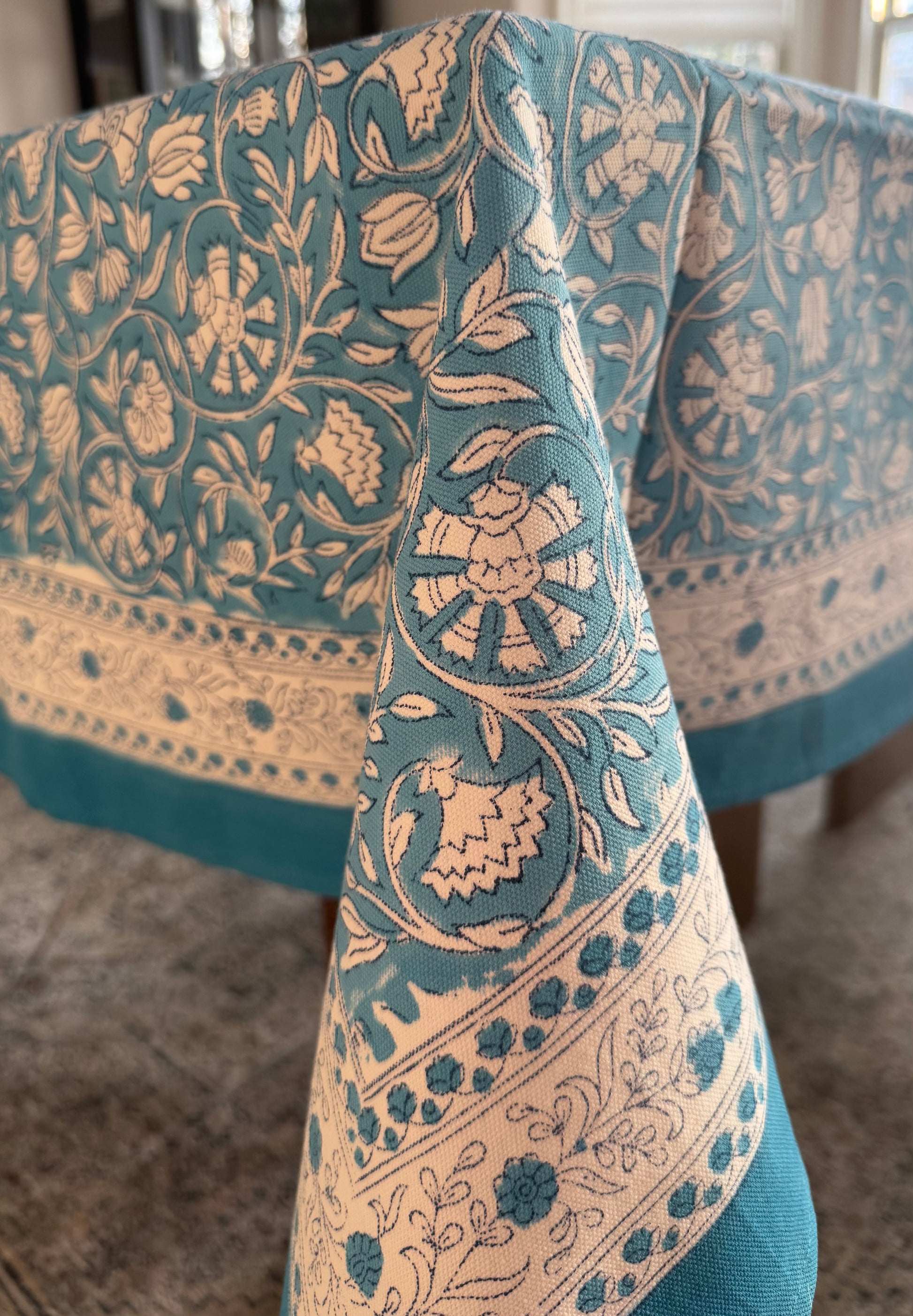 House of Mulmul - Blockprinted Cotton Table Cloth. Close-up of a blue and beige patterned table cover.