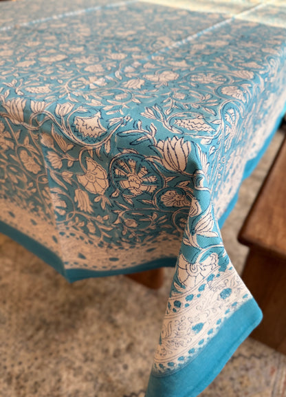 House of Mulmul - Blockprinted Cotton Table Cloth. Blue and white patterned tablecloth on a wooden table
